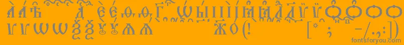 TriodionCapsKucsSpacedout-Schriftart – Graue Schriften auf orangefarbenem Hintergrund