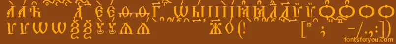 フォントTriodionCapsKucsSpacedout – オレンジ色の文字が茶色の背景にあります。