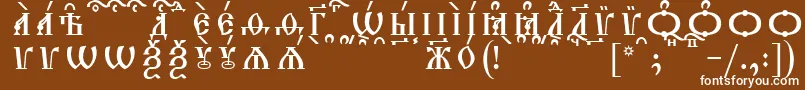 フォントTriodionCapsKucsSpacedout – 茶色の背景に白い文字