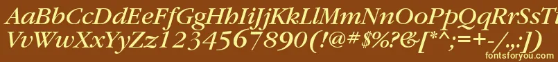 GaramondbookgttItalic-fontti – keltaiset fontit ruskealla taustalla