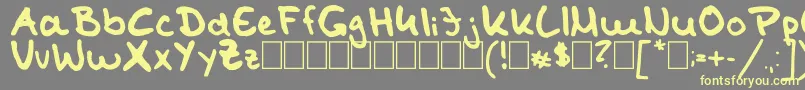 TomKaulitzHandwritingFontByShaiza7 Font – Yellow Fonts on Gray Background