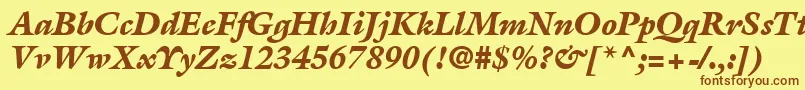 フォントAcanthusBlackSsiBlackItalic – 茶色の文字が黄色の背景にあります。