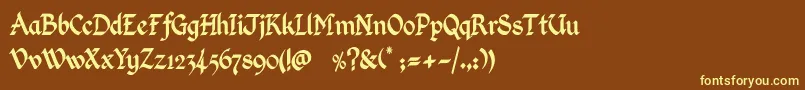 KingthingsCalligraphica-fontti – keltaiset fontit ruskealla taustalla