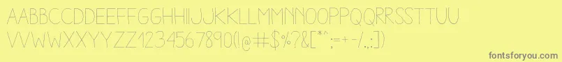 AracneLight-fontti – harmaat kirjasimet keltaisella taustalla