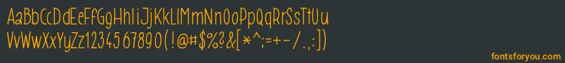 フォントGomez009 – 黒い背景にオレンジの文字