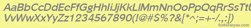 PhinsterBoldItalic-fontti – harmaat kirjasimet keltaisella taustalla