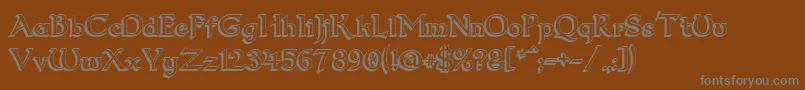 Dum23D-fontti – harmaat kirjasimet ruskealla taustalla