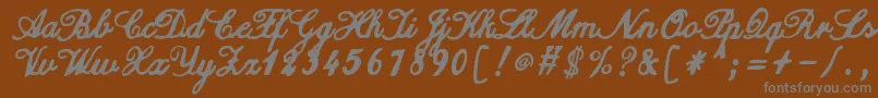 ZaiCalligraphyscripthandwritten Font – Gray Fonts on Brown Background