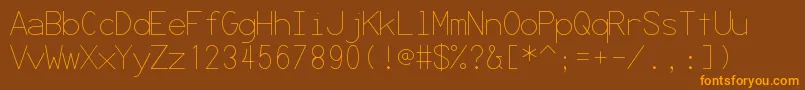フォントSecret ffy – オレンジ色の文字が茶色の背景にあります。