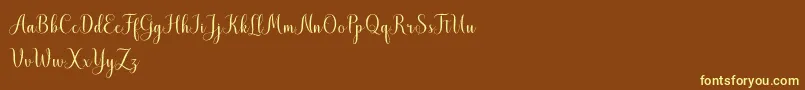MistletoeScriptDemo Font – Yellow Fonts on Brown Background