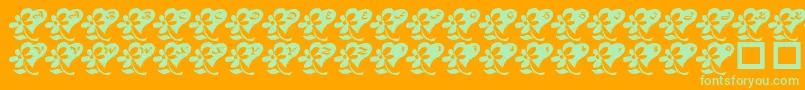 LcrFlowersFromMyHeart Font – Green Fonts on Orange Background