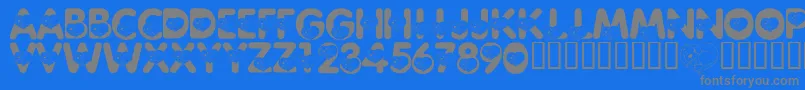 LmsCliffordTheBigRedFont-fontti – harmaat kirjasimet sinisellä taustalla