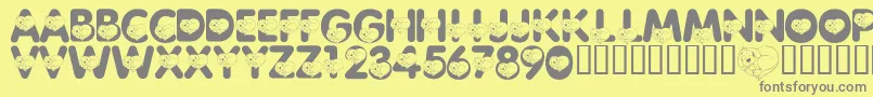 LmsCliffordTheBigRedFont-fontti – harmaat kirjasimet keltaisella taustalla