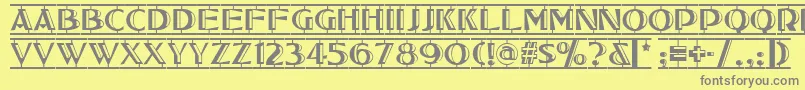 フォントTucson – 黄色の背景に灰色の文字