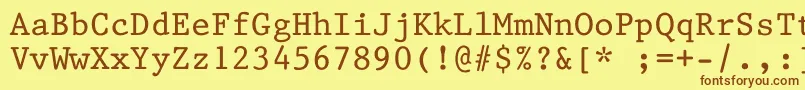 フォントKin668 – 茶色の文字が黄色の背景にあります。