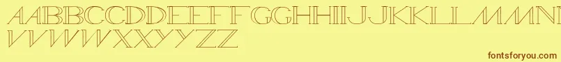 フォントWamed – 茶色の文字が黄色の背景にあります。