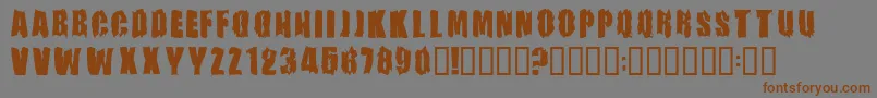 Firebombフォントについての詳細 フォントFirebomb – 茶色の文字が灰色の背景にあります。