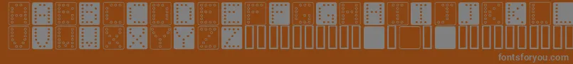 フォントDominoSquare – 茶色の背景に灰色の文字