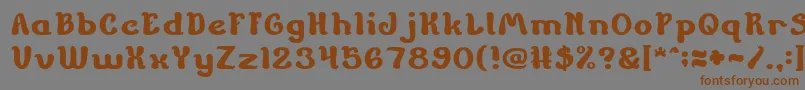 フォントChildrenStoriesBold – 茶色の文字が灰色の背景にあります。