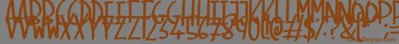 フォントSkinnyMarker – 茶色の文字が灰色の背景にあります。