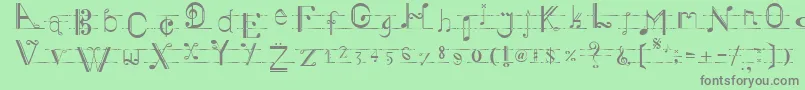 Musiker-fontti – harmaat kirjasimet vihreällä taustalla