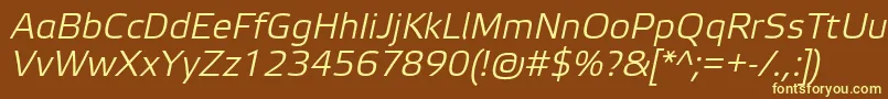 ElektraLightProItalic-fontti – keltaiset fontit ruskealla taustalla