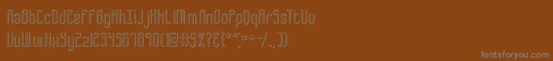 B2sqol2-fontti – harmaat kirjasimet ruskealla taustalla