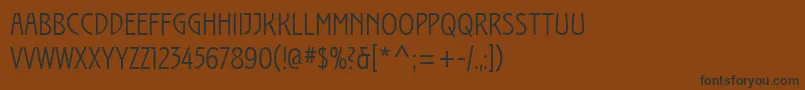 フォントIzisOne – 黒い文字が茶色の背景にあります