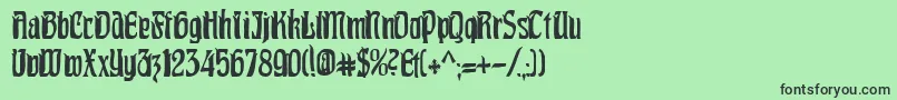 PittoreskCondensed Font – Black Fonts on Green Background