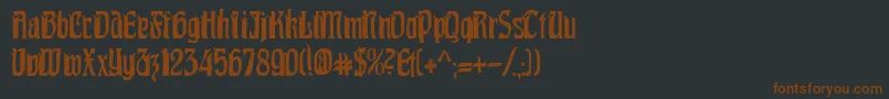 PittoreskCondensed Font – Brown Fonts on Black Background