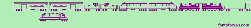 フォントTrains – 緑の背景に紫のフォント