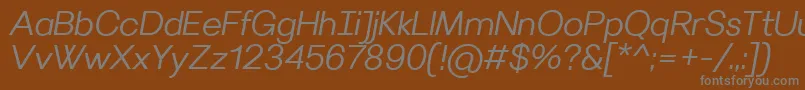 VilleraySemilightitalic-fontti – harmaat kirjasimet ruskealla taustalla