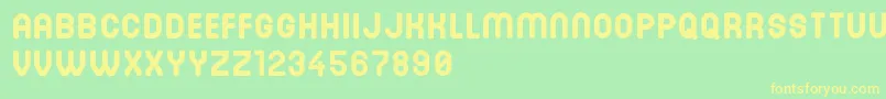 DinastiBold-Schriftart – Gelbe Schriften auf grünem Hintergrund