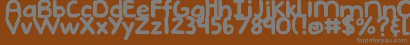 DjbEmphatic-Schriftart – Graue Schriften auf braunem Hintergrund