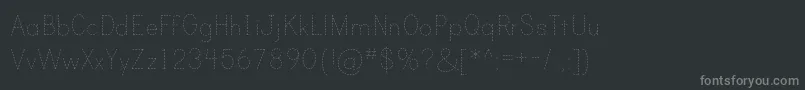 PrintDashedTt-fontti – harmaat kirjasimet mustalla taustalla