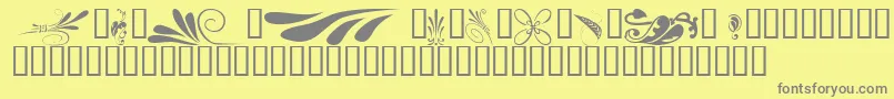 KrSimpleFleur6-fontti – harmaat kirjasimet keltaisella taustalla
