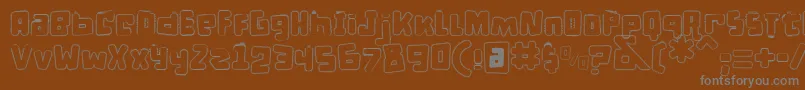 DPuntillasCLace-fontti – harmaat kirjasimet ruskealla taustalla