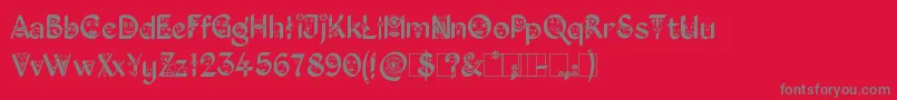 Czcionka KingthingsFacetype – szare czcionki na czerwonym tle