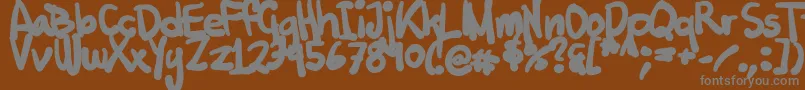 Więcej informacji o czcionce Tuschtouch2 Czcionka Tuschtouch2 – szare czcionki na brązowym tle