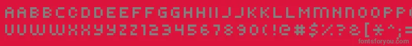 フォントKroeger0856 – 赤い背景に灰色の文字