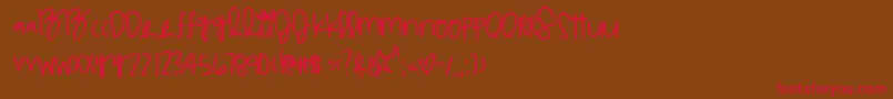 フォントMulticoloragilitys – 赤い文字が茶色の背景にあります。