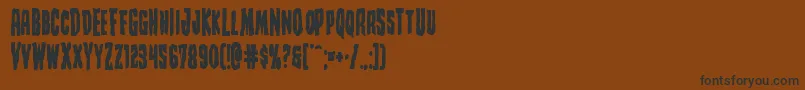 フォントCreepycrawlersbold – 黒い文字が茶色の背景にあります