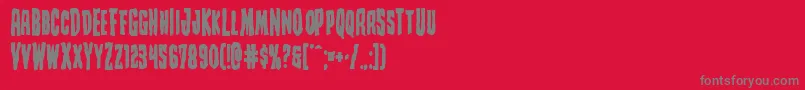 フォントCreepycrawlersbold – 赤い背景に灰色の文字