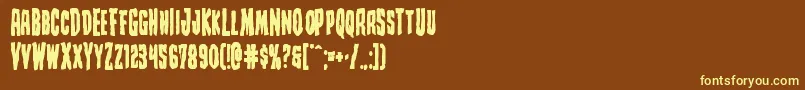 Creepycrawlersbold-fontti – keltaiset fontit ruskealla taustalla