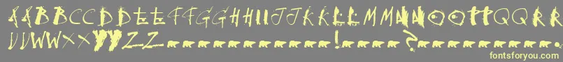 Collateraldamage-Schriftart – Gelbe Schriften auf grauem Hintergrund