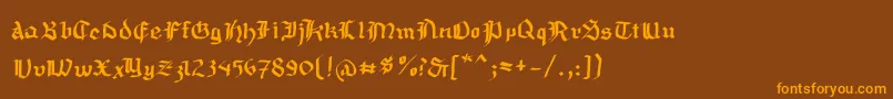 Mousefraktur Font – Orange Fonts on Brown Background