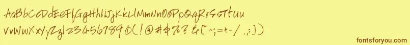 フォントHandscriptuprightRegular – 茶色の文字が黄色の背景にあります。