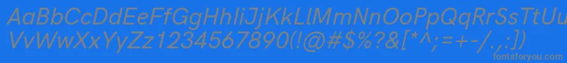 HkgroteskMediumlegacyitalic-Schriftart – Graue Schriften auf blauem Hintergrund