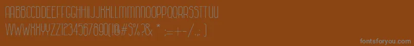 フォントColonialhavanaClara – 茶色の背景に灰色の文字