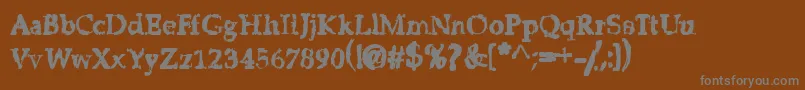 StripClubMotionSicknessGrungeDeluxe Font – Gray Fonts on Brown Background